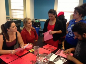 Student Support Services staff members, Julie Tarter and Danielle Russell, talking to students about information on cardiovascular disease.