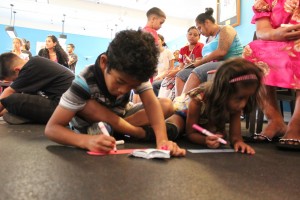 Children from Kuhio Park Terrace working on an activity. Photo courtesy of Martin Moore.