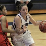 Hannah Curtis aggresively drives to the basketPhoto by: Kevin Hashiro