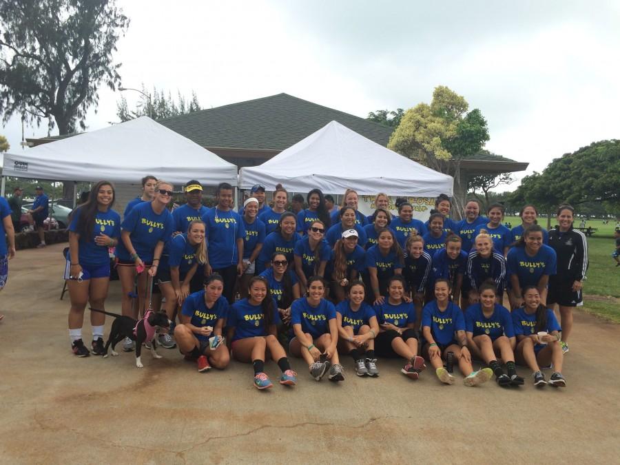 Joined by the womens soccer team, the Chaminade softball girls came together to support their coach George La Rosa in a memorial walk for his daughter.
