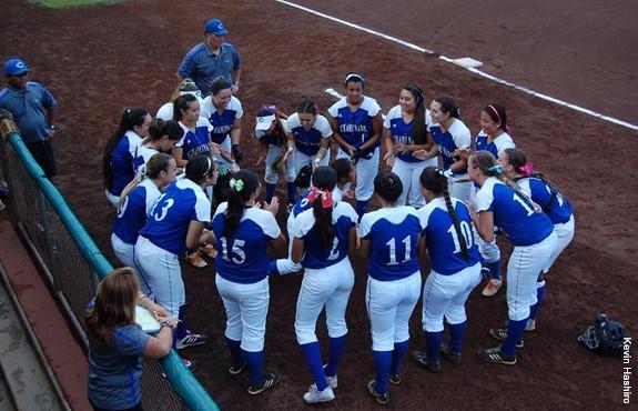 Chaminade womens softball in a huddle at the UH tournament last season in November.