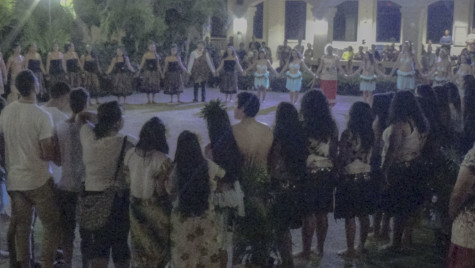 The audience and participants conduct a prayer together.