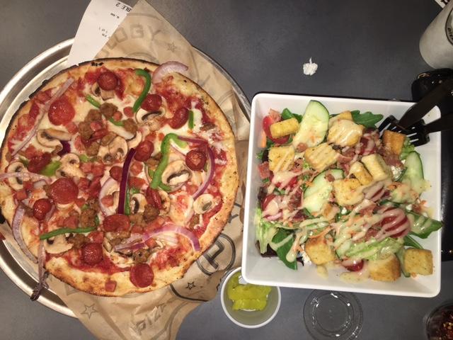 Custom pizza and salad topped with an abundance of fresh, flavorful ingredients from Pieology Aina Haina. 