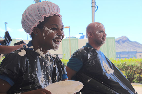 Sahtiya Hammel (left) and Danny OReagan volunteered for the pie tossing booth.