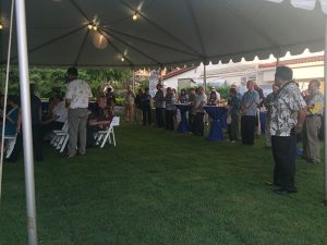 The faculty of Chaminade join to dedicate Ching Hall on the lawn