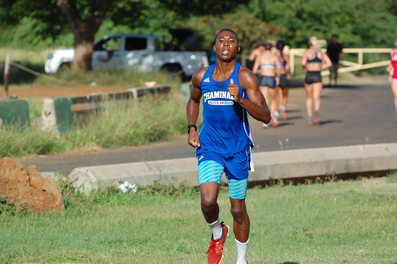 Antonio Bonnetty pushing through pain to finish the last mile of a cross-country race at Sand Island in Honolulu