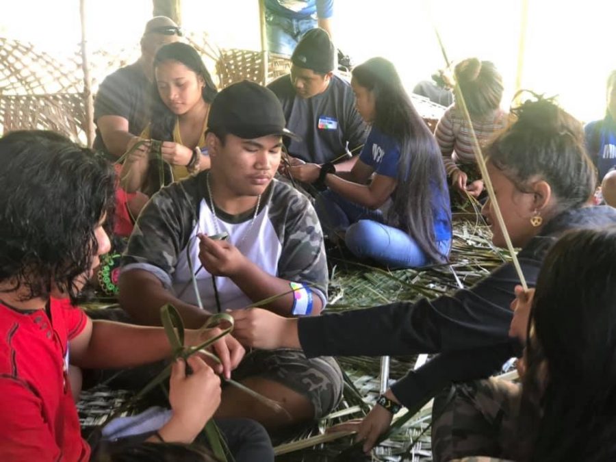Students were taught to weave under an outdoor Chuukese hut that the island calls an iteruk, which means thinking house.
