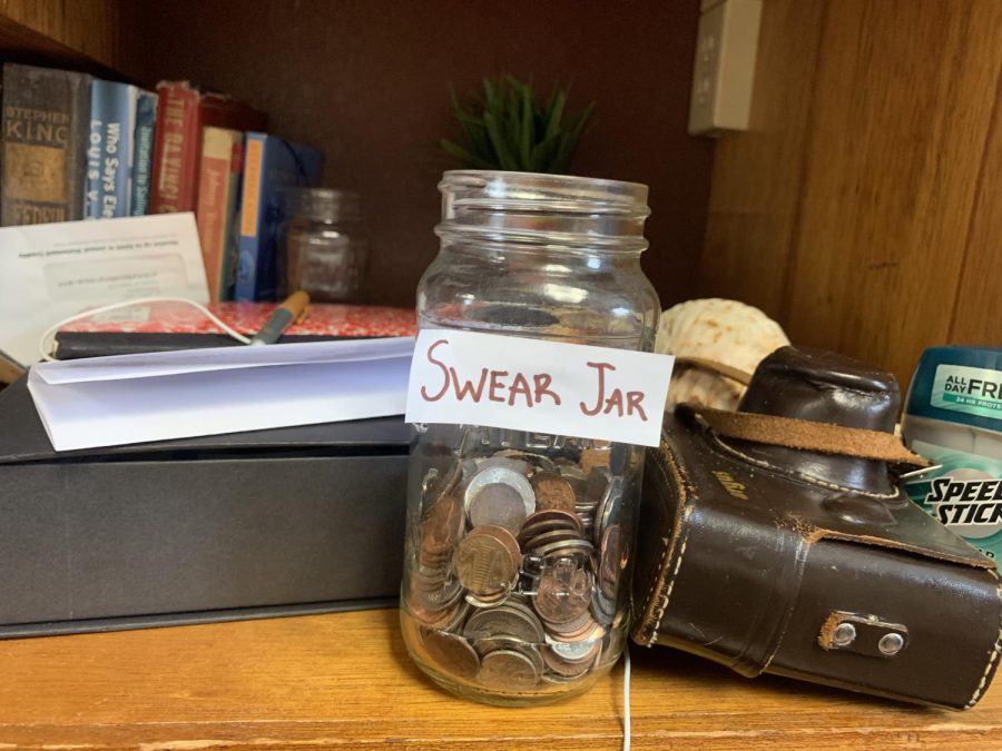 Half-full swear jar half way through the first month of the new year. Looks like a mouth full of soap can lead to a jar full of change. 