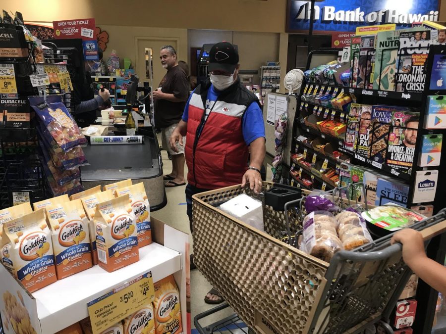 Safeway in Kaneohe adhering to social distancing guidelines by using distance markers on the floor while customers pay for their items. 