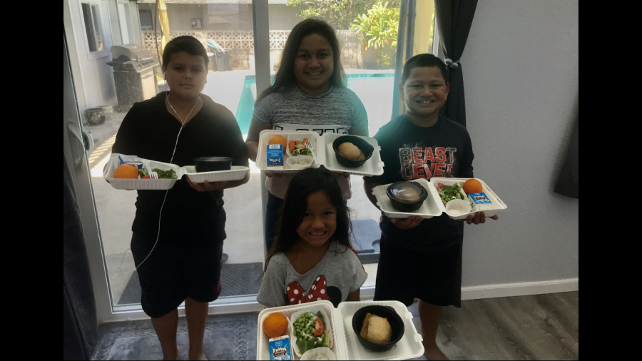 Children look forward to opening up their plates to see what they get to eat from the grab-and go program at King Intermediate.