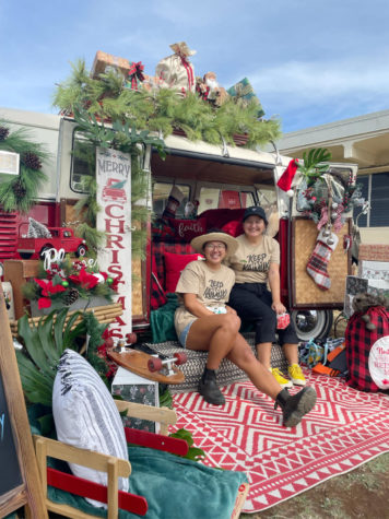 Keep It Kaimuki Saturday volunteer Morgan Nishisaka (left) and roommate Olivia (right) pose for a picture at the @theothebushawaii Christmas pop-up.