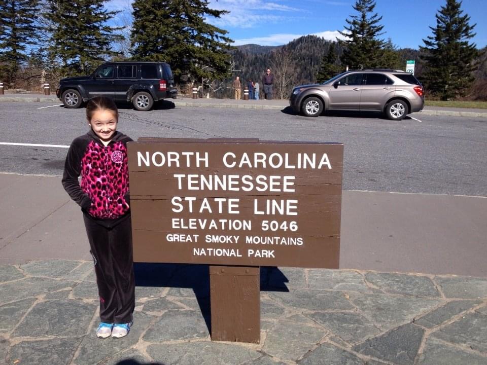 A typical roadtrip photo consists of a sign and the children on the trip being forced to pose. (Photo courtesy of Desiree Frasure)