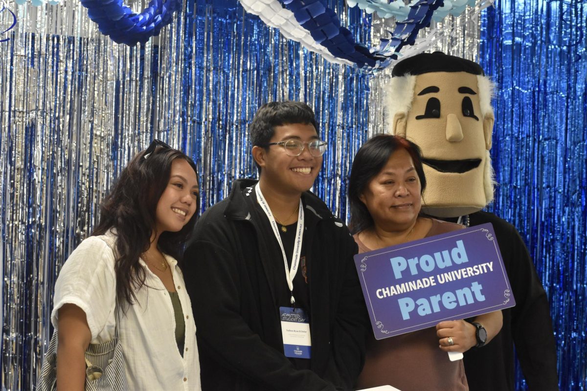 Nathen-Ryan Dolor was the first future Silversword to take some photos at the celebration room with their special guest , Father Chaminade.