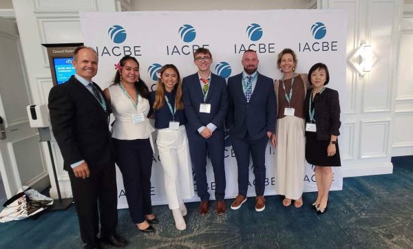 Eddie Merc (far left) helped with the IACBE Business Competition and helped the team to victory in Orlando in 2023. 